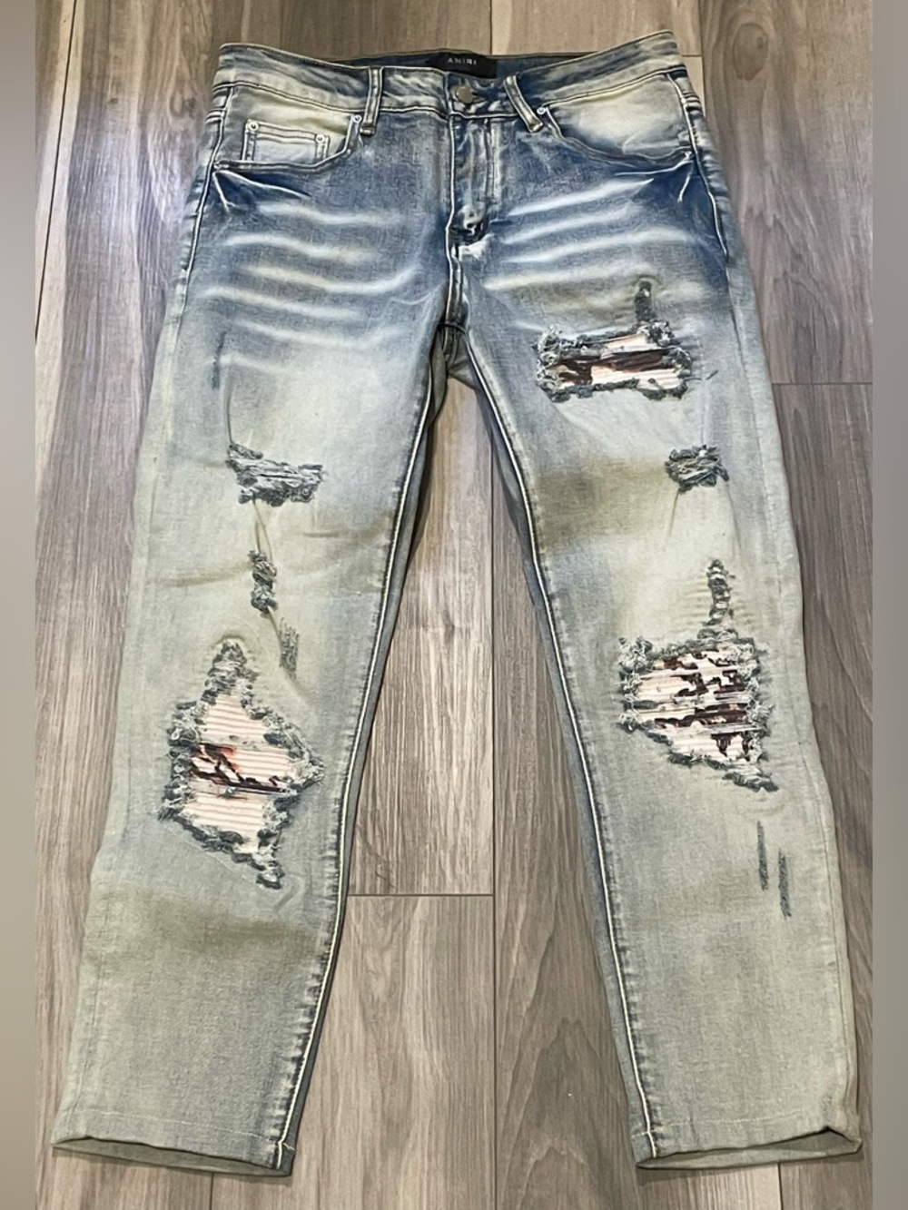 AMIRI Light Wash Distressed Ankle Jeans